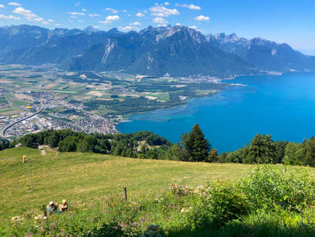 Panorama of the Switzerland Alpine mountains. Ridges, peaks and lake are visible in the background. Beautiful view in the French Canton.の写真素材