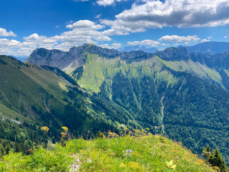 Panorama of the Switzerland Alpine mountains. Ridges, peaks and lakes are visible in the background. Beautiful view in the French Canton.の写真素材