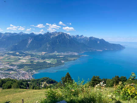 Panorama of the Switzerland Alpine mountains. Ridges, peaks and lakes are visible in the background. Beautiful view in the French Canton.の写真素材