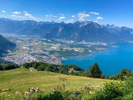 Panorama of the Switzerland Alpine mountains. Ridges, peaks and lake are visible in the background. Beautiful view in the French Canton.の写真素材