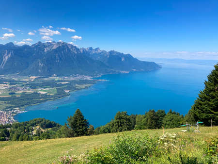 Panorama of the Switzerland Alpine mountains. Ridges, peaks and lake are visible in the background. Beautiful view in the French Canton.の写真素材