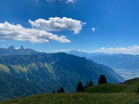 Panorama of the Switzerland Alpine mountains. Ridges, peaks and lake are visible in the background. Beautiful view in the French Canton.の写真素材