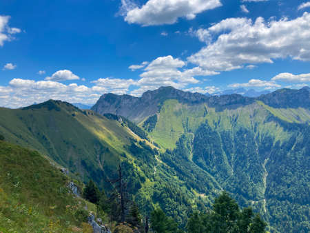 Panorama of the Switzerland Alpine mountains. Ridges, peaks and lake are visible in the background. Beautiful view in the French Canton.の写真素材