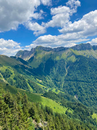 Panorama of the Switzerland Alpine mountains. Ridges, peaks and lake are visible in the background. Beautiful view in the French Canton.の写真素材