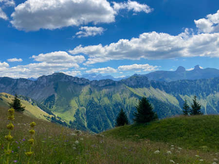 Panorama of the Switzerland Alpine mountains. Ridges, peaks and lake are visible in the background. Beautiful view in the French Canton.の写真素材