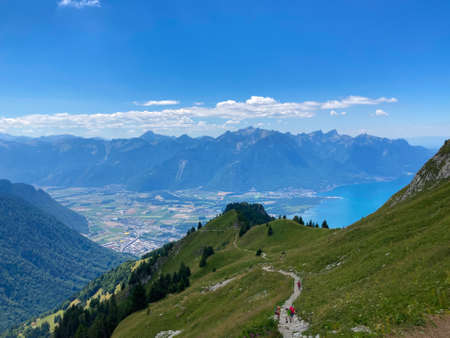 Panorama of the Switzerland Alpine mountains. Ridges, peaks and lake are visible in the background. Beautiful view in the French Canton.の写真素材