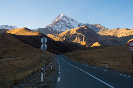 Georgia : 10-11-2022 : Country of Georgia, Kazbegi, Panoramic landscape of beautiful natural mountains, view of amazing Caucasus mountain peaks and meadows in Kazbegi national park.の写真素材