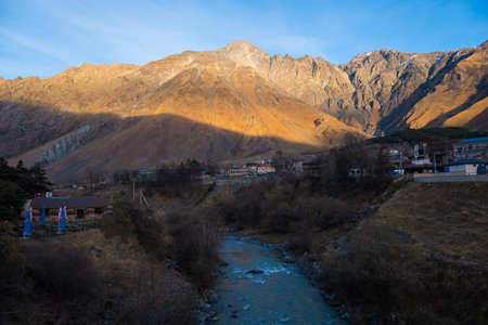 Kazbegi, Georgia : 10-11-2022 : Village Of Gergeti In Georgia, with the beautiful Caucasus mountain peaks and meadow surrounded .の写真素材