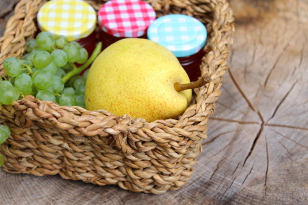 Basket with fruits and grape jellyの写真素材