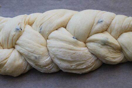 Fresh braided yeast bun dough