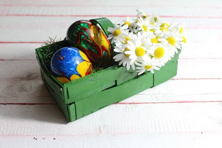 Happy easter decoration with flowers and a eastereggの写真素材