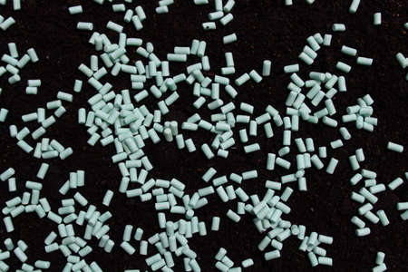 many snail pellets on the soil