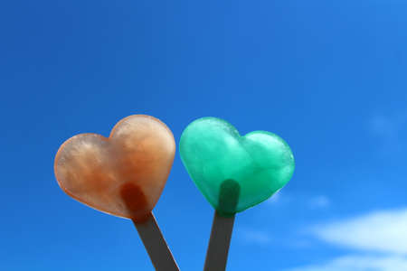 heart shaped ice in front of the summer sky