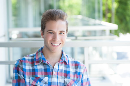 Attractive young male smiling at cameraの写真素材