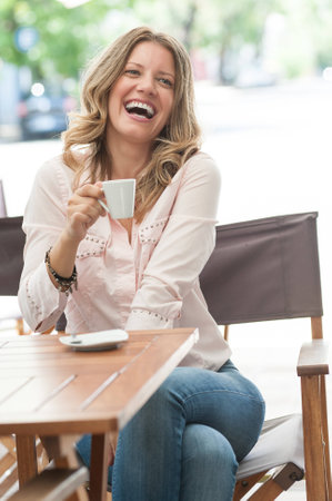 Beautiful woman drinking coffeeの写真素材