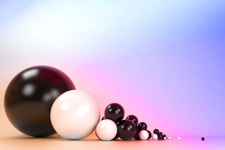 Plastic balls of different sizes on a colorful backgroundの写真素材