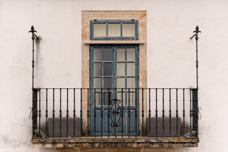 Old window on the facade of a house in Lisbon, Portugal.