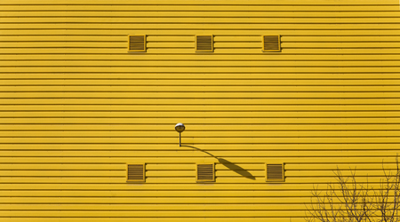 Yellow facade in an industrial poloのeditorial素材