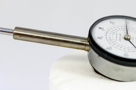 a pressure gauge with black text on a white faceの写真素材