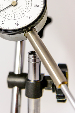 a pressure gauge with black text on a white face