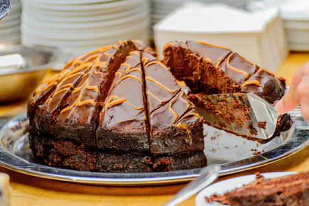 Chocolate cake being served at a business party