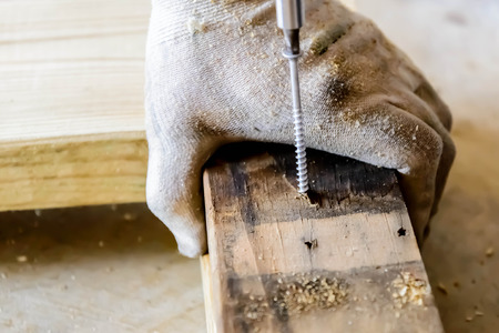 hand and tools doing wood work construction projectの写真素材