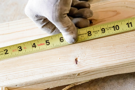 hand and tools doing wood work construction project