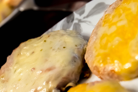 cheeseburgers with condiments ready for eating