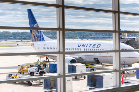 DCA, Reagan National Airport, Washington, DC - View out airport window to airplanes and ramp operationsのeditorial素材