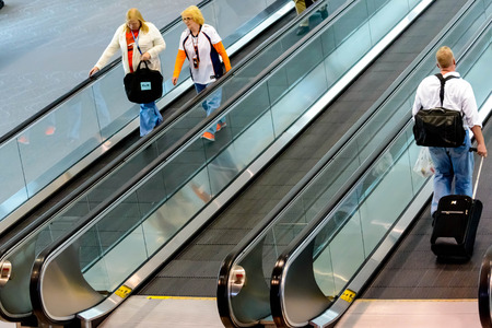DIA, DEN, Denver International Airport, CO - People walking with luggage in airportのeditorial素材