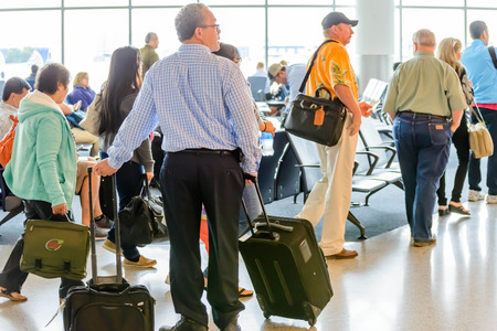 IAH, Houston Intercontinental Airport, Houston, TX, USA - Passengers queued in line for boarding at departure gateのeditorial素材