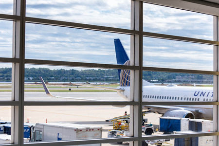 DCA, Reagan National Airport, Washington, DC - View out airport window to airplanes and ramp operationsのeditorial素材