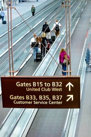 DIA, DEN, Denver International Airport, CO - People walking with luggage in airportのeditorial素材