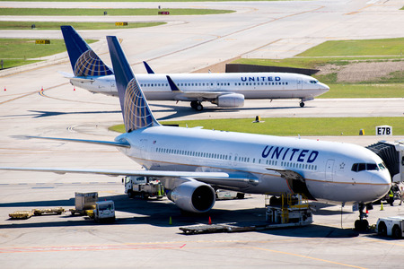 IAH, Houston Intercontinental Airport, Houston, TX, USA - airplanes on the active ramp at IAH airportのeditorial素材