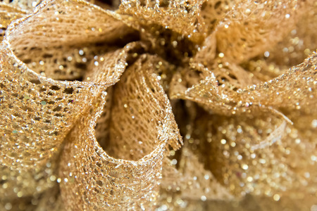 Christmas decorations - gold bow tied with a ribbonの写真素材