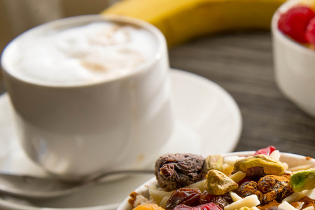 Fresh fruit and oatmeal with nuts and fruit toppings for breakfastの写真素材