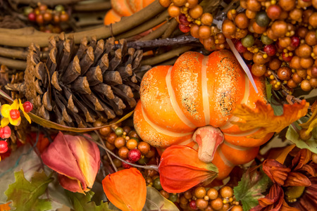 colorful fall decorations - pumpkins, leaves, pine cones