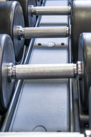 Indoor exercise equipment - free weights stacked on the rack
