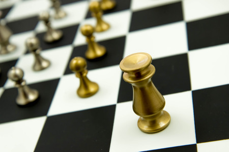 Classic chess game - pieces in play on chessboardの写真素材