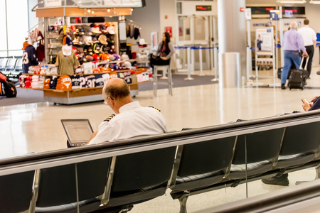 IAH, Houston Intercontinental Airport, Houston, TX, USA - passengers walking with lugagge in airportのeditorial素材