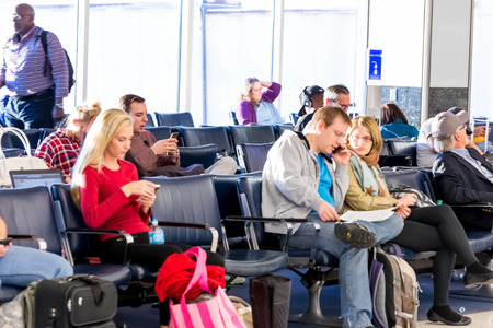 IAH, Houston Intercontinental Airport, Houston, TX, USA - passengers walking with lugagge in airportのeditorial素材