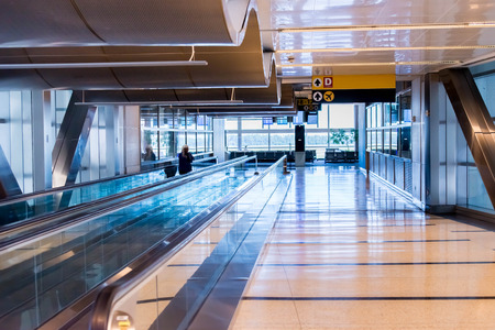 IAH, Houston Intercontinental Airport, Houston, TX, USA - passengers walking with lugagge in airportのeditorial素材