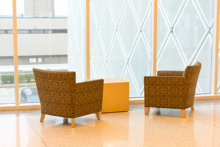 IAH, Houston Intercontinental Airport, Houston, TX, USA - empty chair in front of window in airportのeditorial素材
