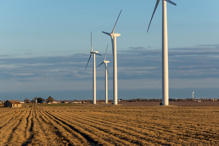 renewable energy wind turbines  in rural hay fields