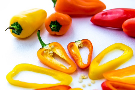 sliced red, yellow, orange hot peppersの写真素材
