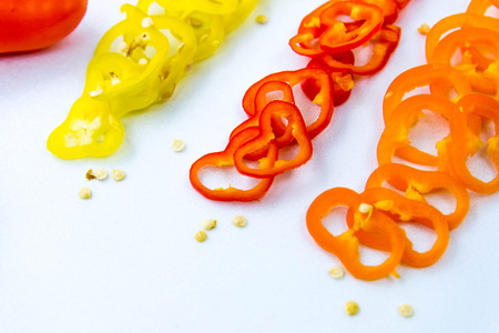 sliced red, yellow, orange hot peppers