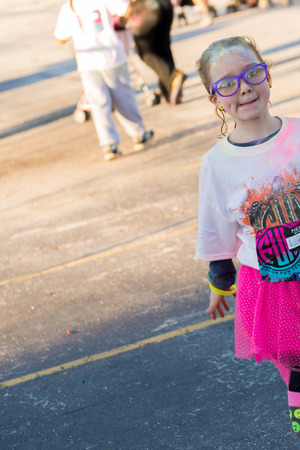 November 1, 2014 - Houston, TX, USA: Color Fun Fest 5K run. Runners completing the course with colored powderのeditorial素材