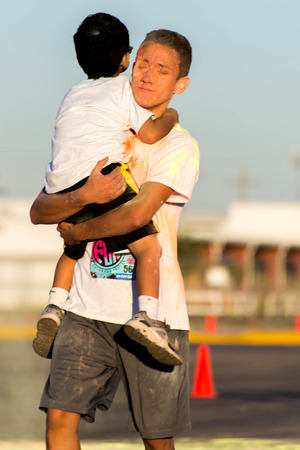 November 1, 2014 - Houston, TX, USA: Color Fun Fest 5K run. Runners completing the course with colored powderのeditorial素材