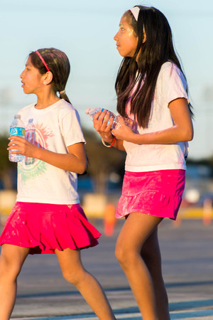 November 1, 2014 - Houston, TX, USA: Color Fun Fest 5K run. Runners completing the course with colored powderのeditorial素材