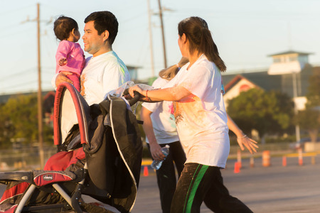 November 1, 2014 - Houston, TX, USA: Color Fun Fest 5K run. Runners completing the course with colored powderのeditorial素材